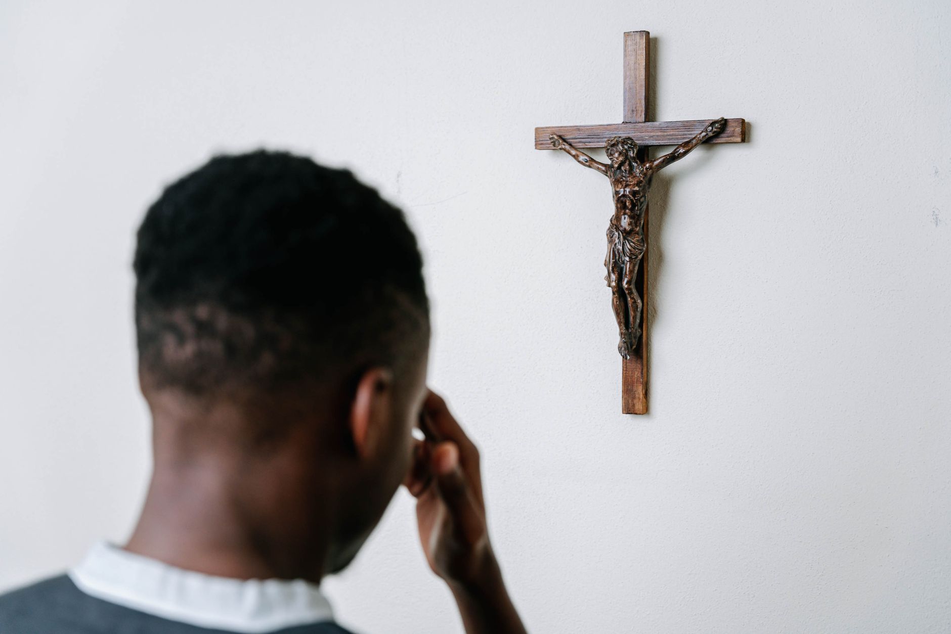 A man kneeling in prayer, faith and devotion