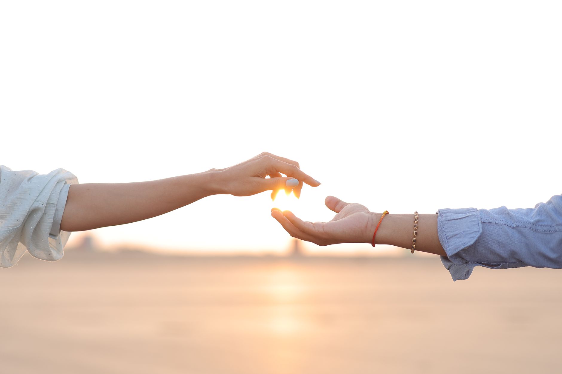 A hand reaching upward into golden light, a picture of receiving God's strength