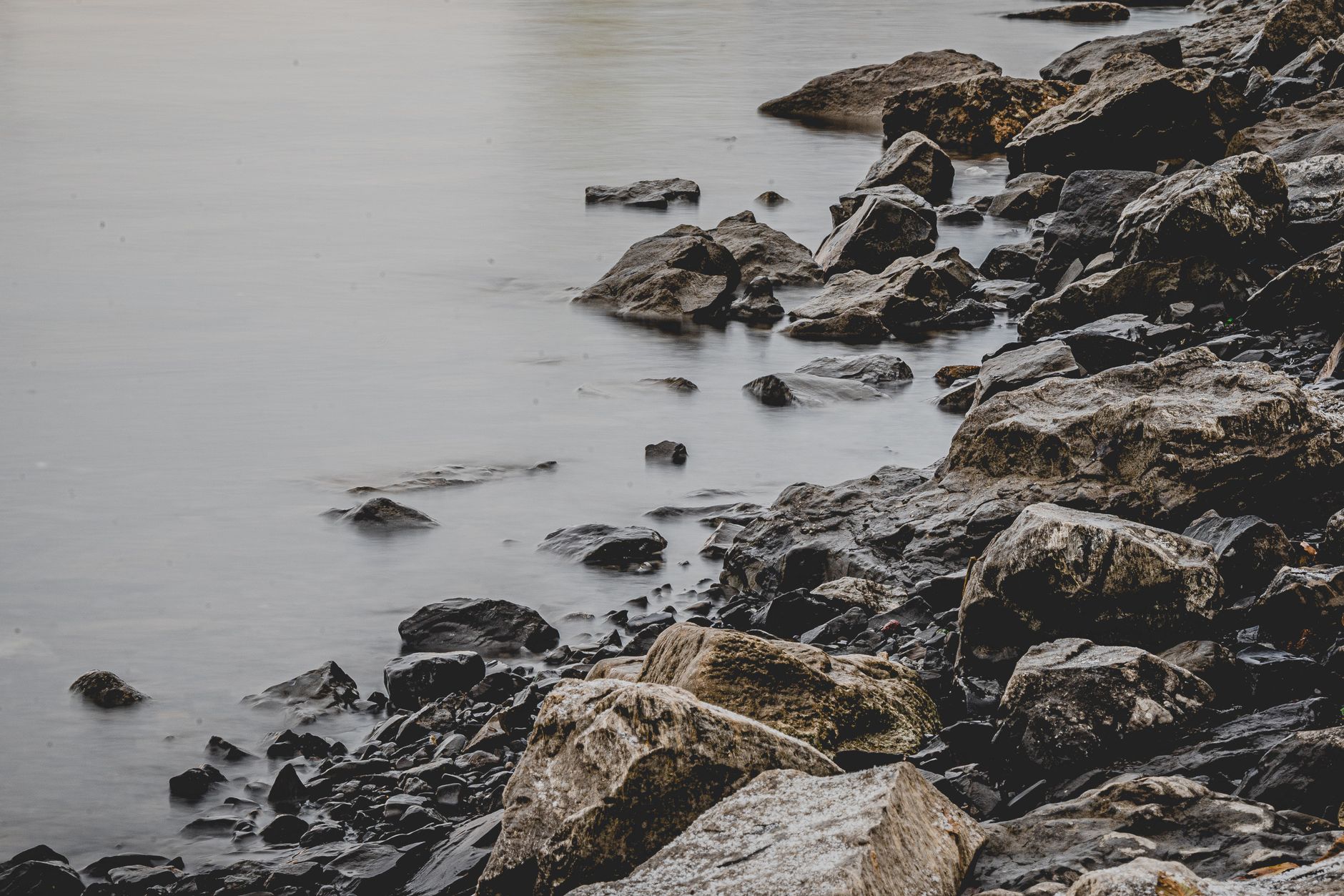 Peaceful water at dawn — the settled calm that holds even when circumstances are uncertain